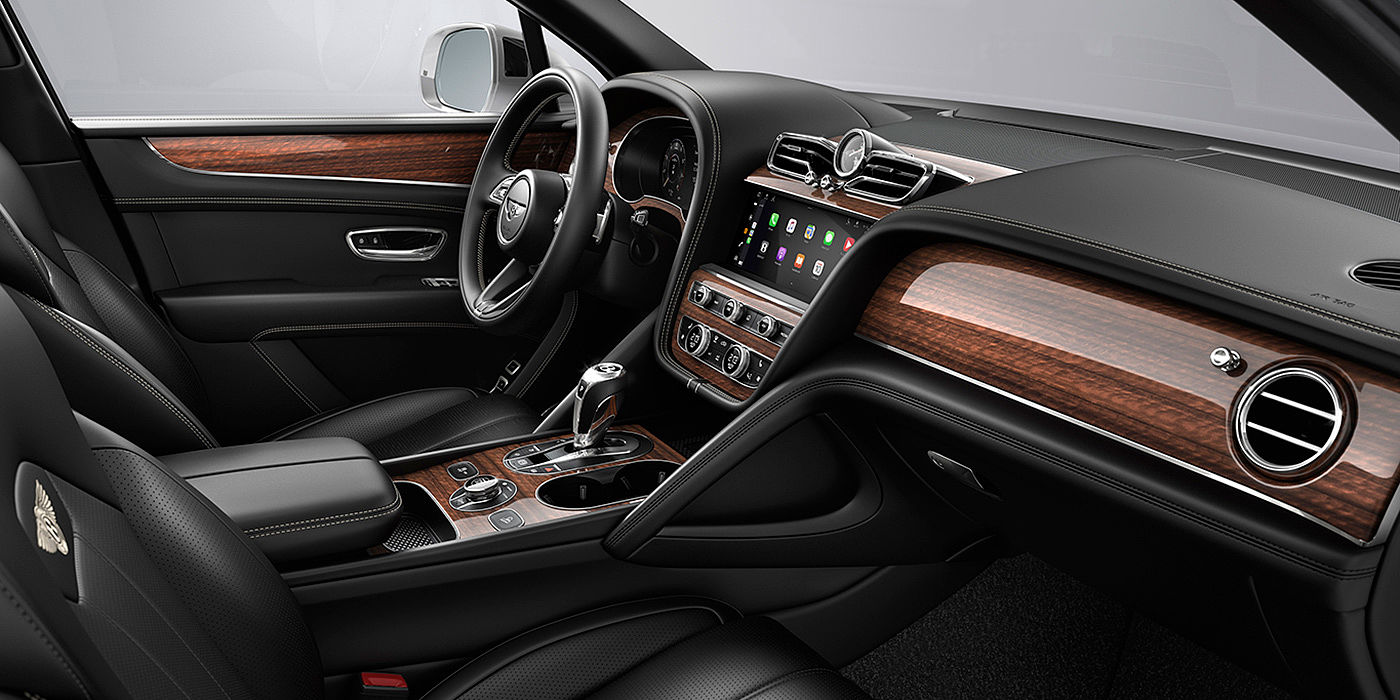Bentley Jinhua Bentley Bentayga interior with a Crown Cut Walnut veneer, view from the passenger seat over looking the driver's seat.
