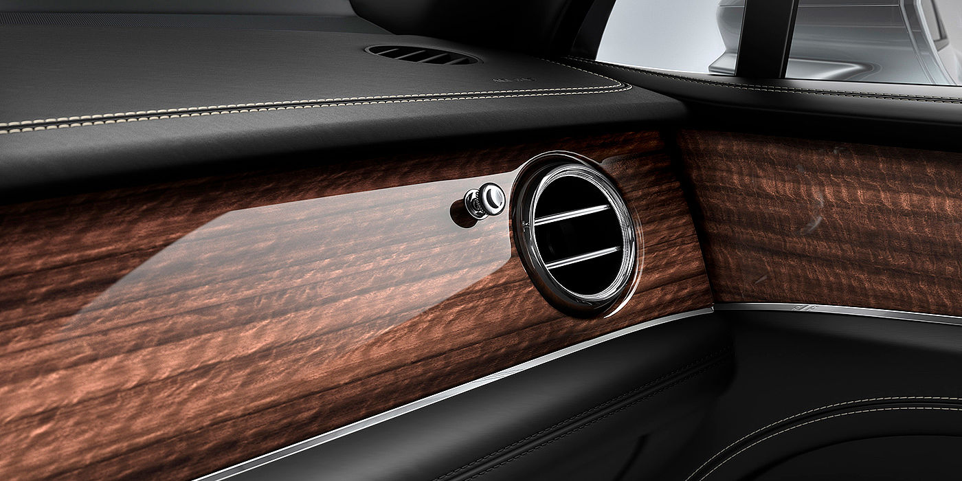 Bentley Jinhua Bentley Bentayga front interior Crown Cut Walnut veneer and chrome air vent.